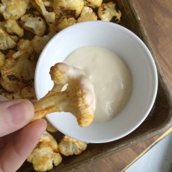 Roasted buffalo cauliflower recipe from nelliebellie.com healthy snack ideas