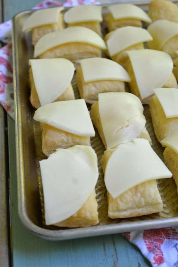 These little Philly Cheese Steak puffs are an easy, delicious appetizer with fresh veggies, flavorful beef, and buttery puff pastry. Easy, fast, and tasty!