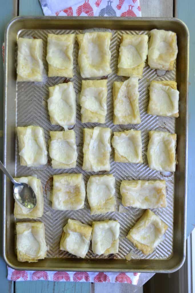 These little Philly Cheese Steak puffs are an easy, delicious appetizer with fresh veggies, flavorful beef, and buttery puff pastry. Easy, fast, and tasty!