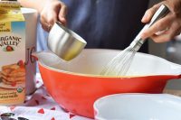 Red glass mixing bowls perfect for baking a cake.