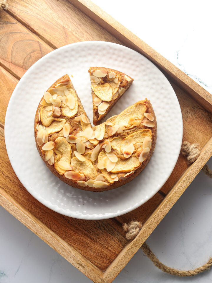 Plate of apple almond cake ready to be eaten.