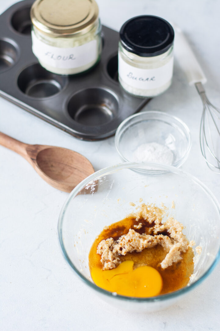 egg added to beaten sugars for cookie cups filled with caramel