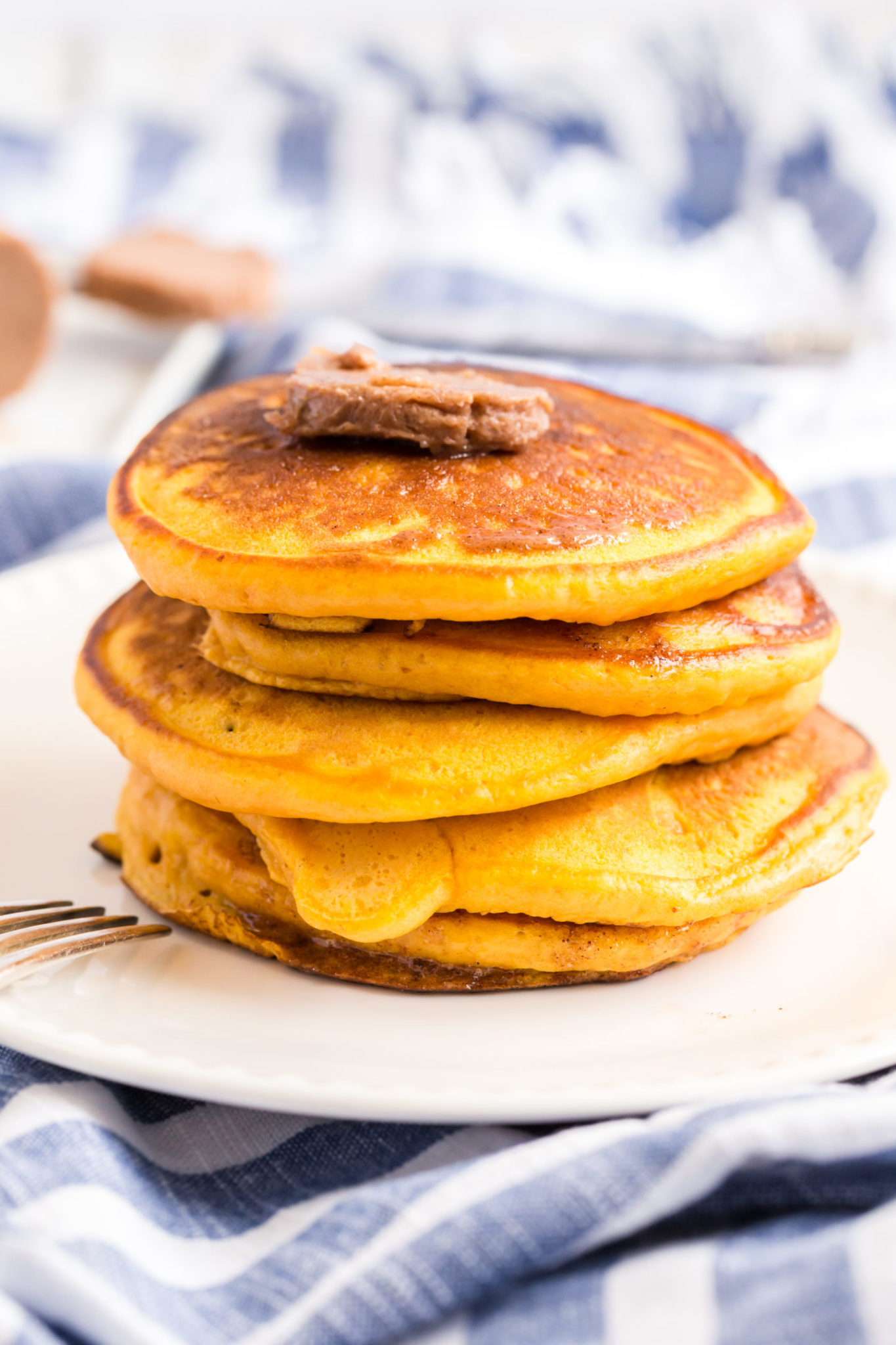 Stack of buttermilk pumpkin pancakes with cinnamon butter