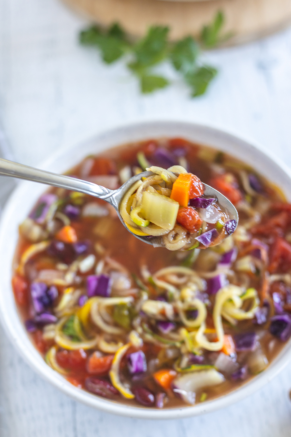 a spoonful of vegetable zoodle soup