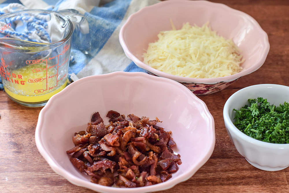 bacon, melted butter, shredded cheese, and chopped parsley