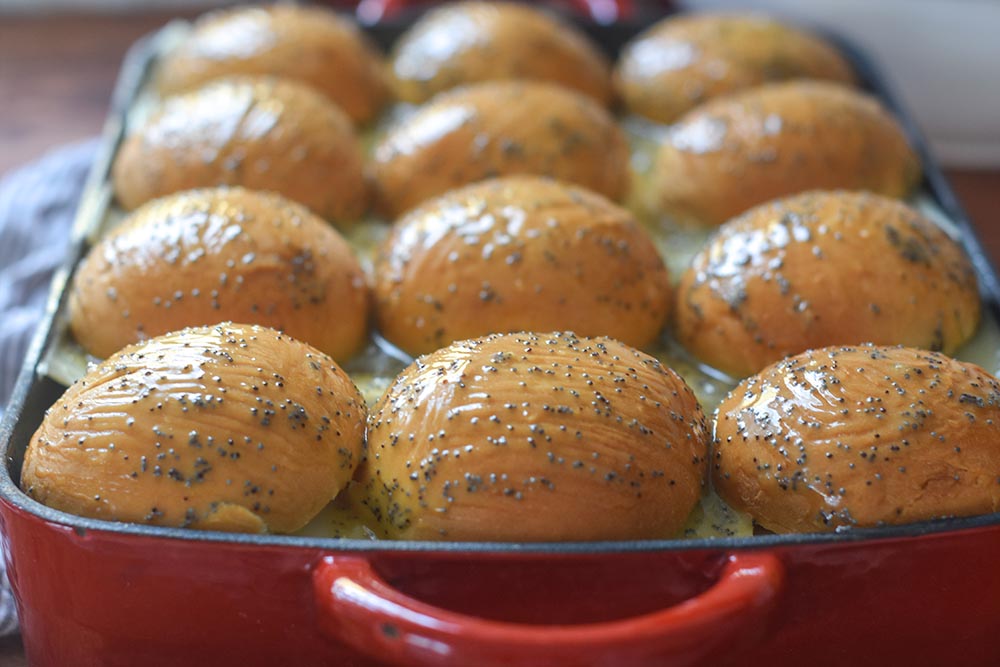 ham and cheese sliders in a pan ready to be baked up