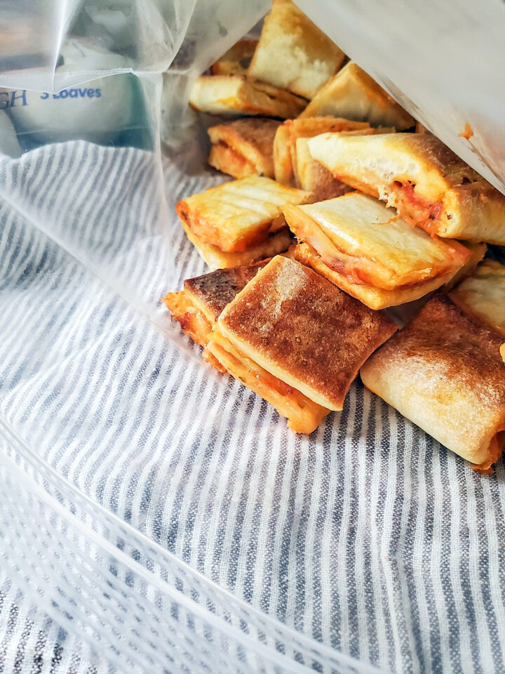 Pizza bites made with Rhodes pizza dough are stored in a freezer bag for later!