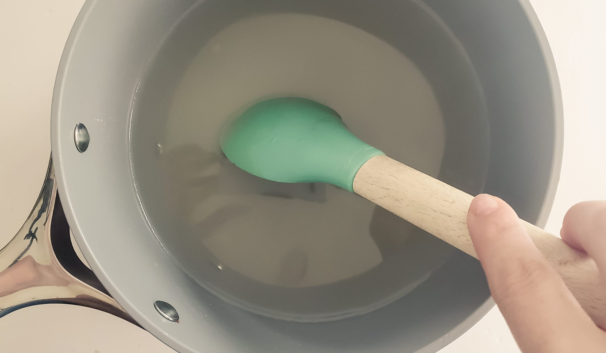 stirring sugar and water for simple syrup