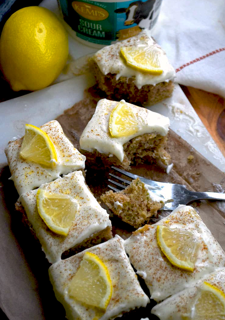 Zucchini bars with cream cheese frosting with lemon zest and lemon juice.